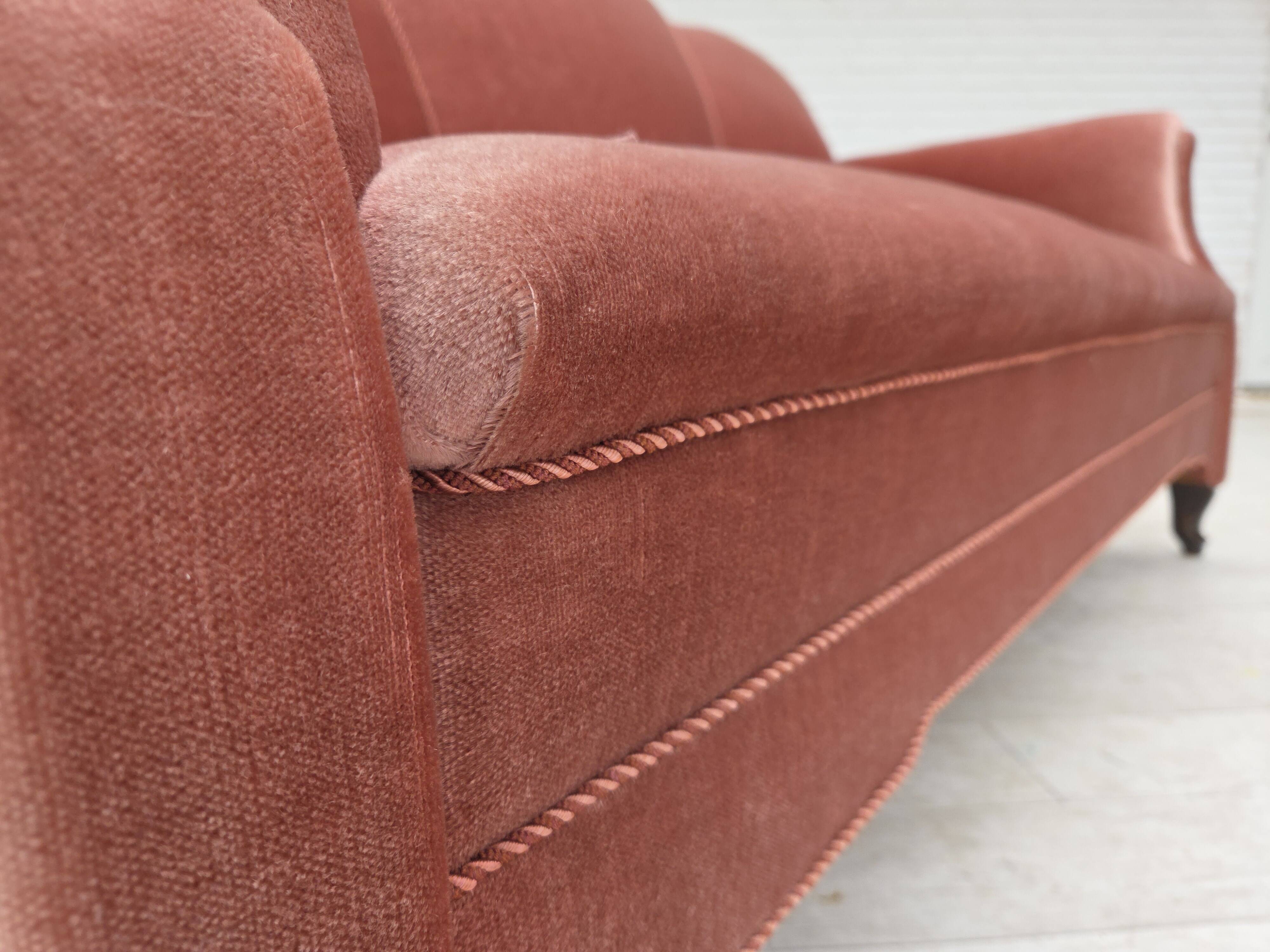 1950s, Danish 2-seater sofa, salmon pink furniture velour, oak wood legs.
