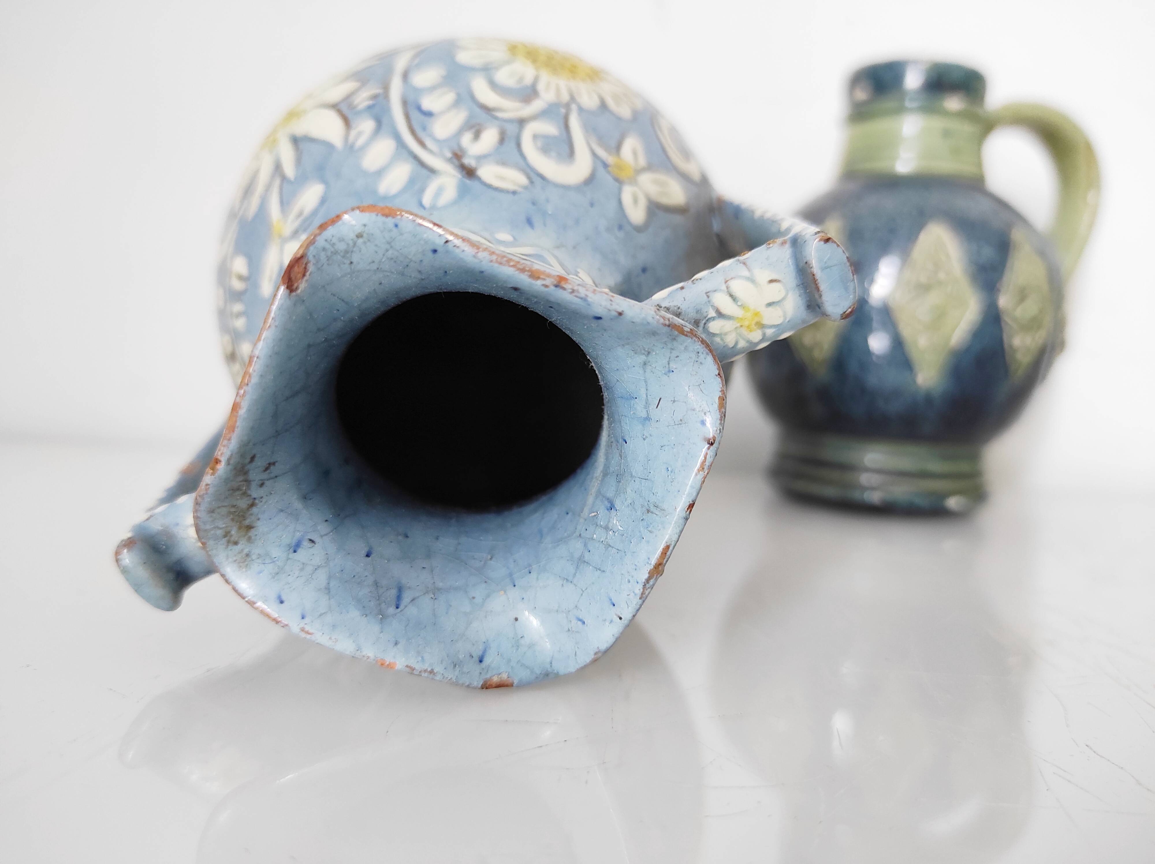 Two small blue ceramic vases
