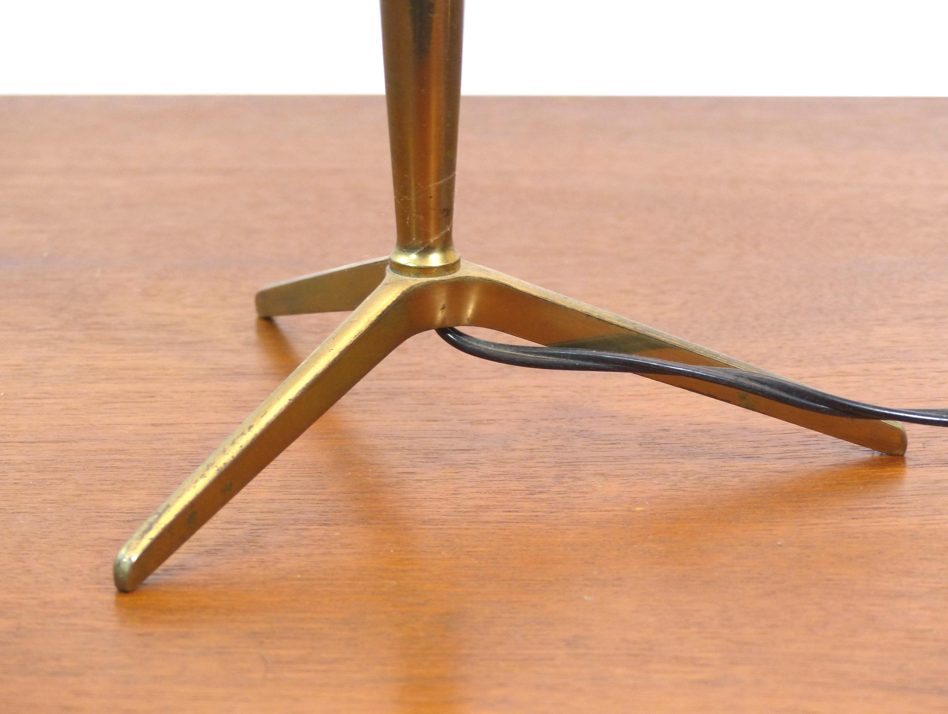 Golden brass tripod table lamp