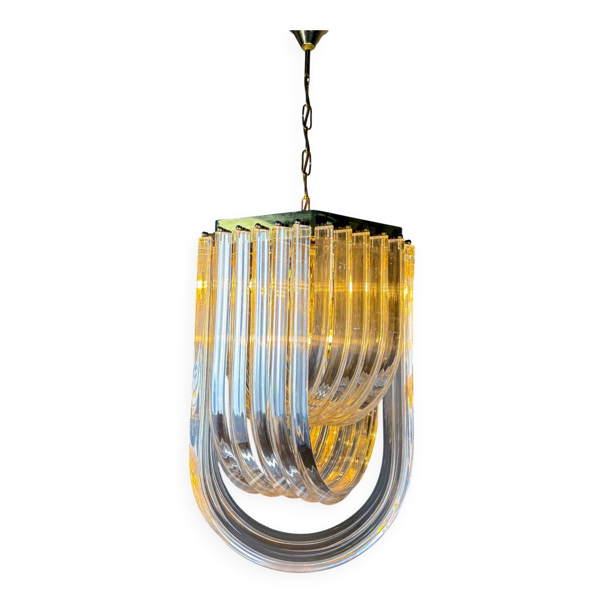 Long mid-century curved Lucite ribbon chandelier in brass, Italy