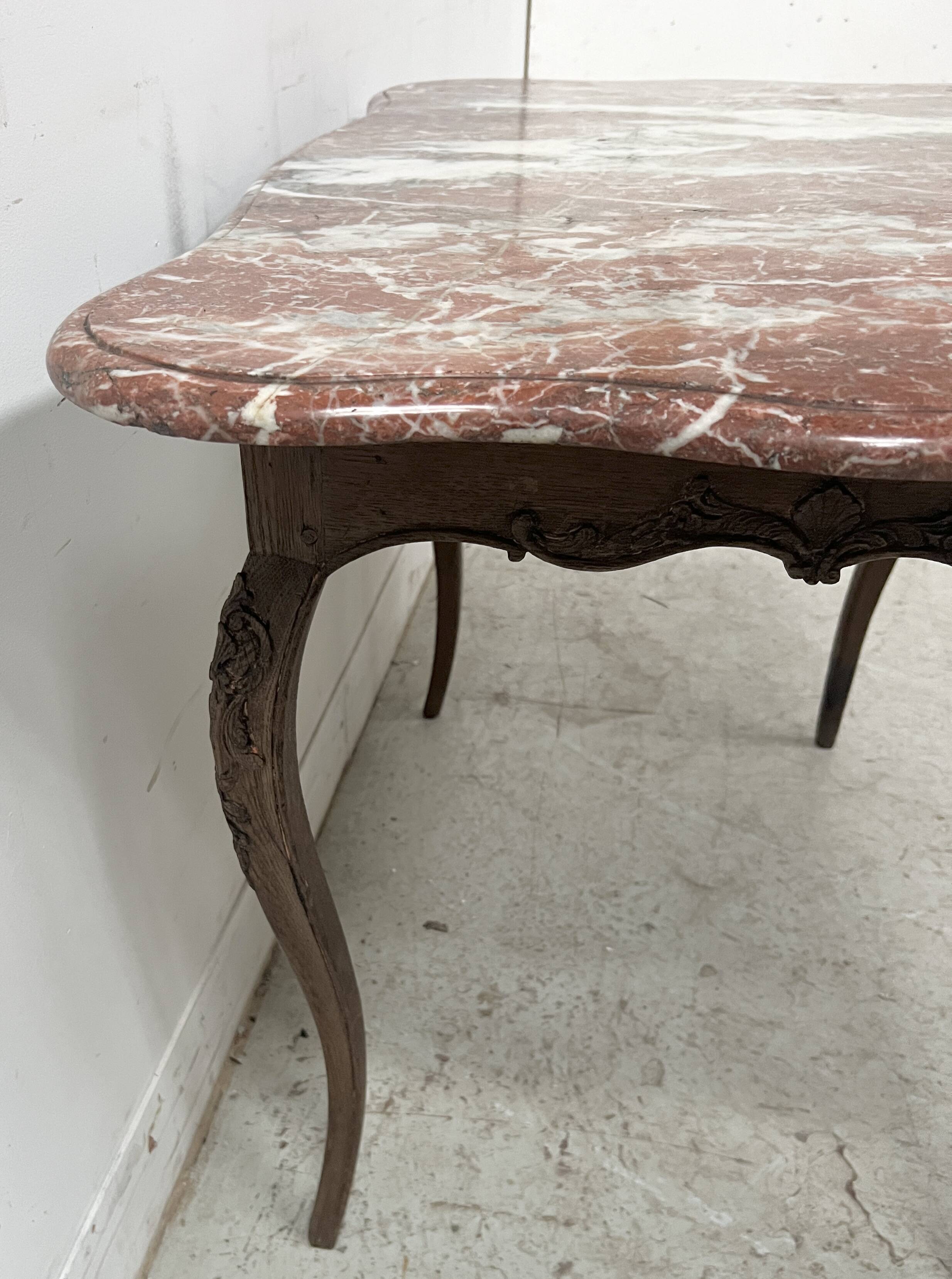 Louis XV mid-table in oak and marble, 18th century.