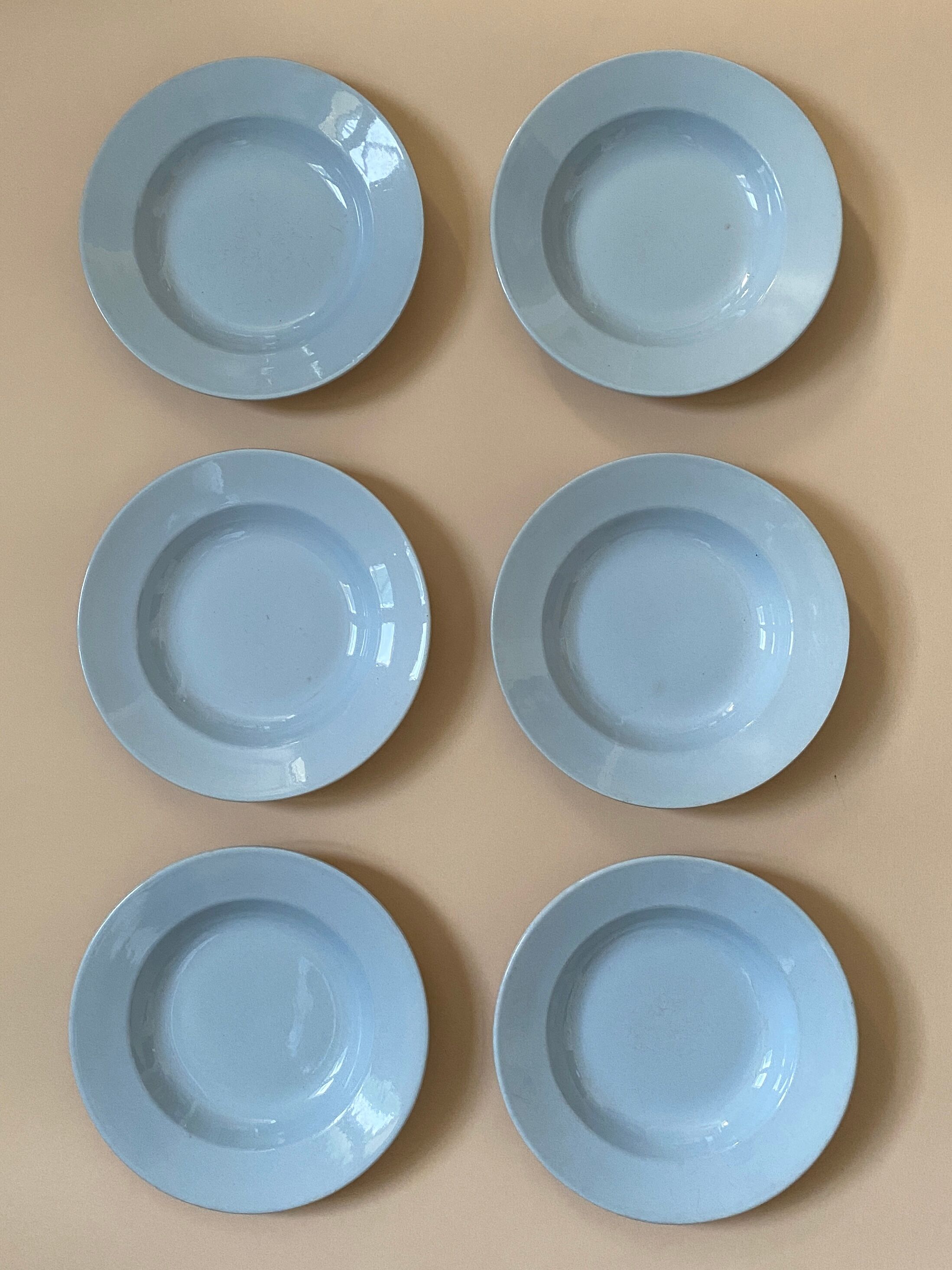 Six blue hollow plates