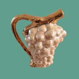 Pitcher of alpho grape cluster