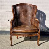 Fauteuil en rotin avec siège en cuir marron