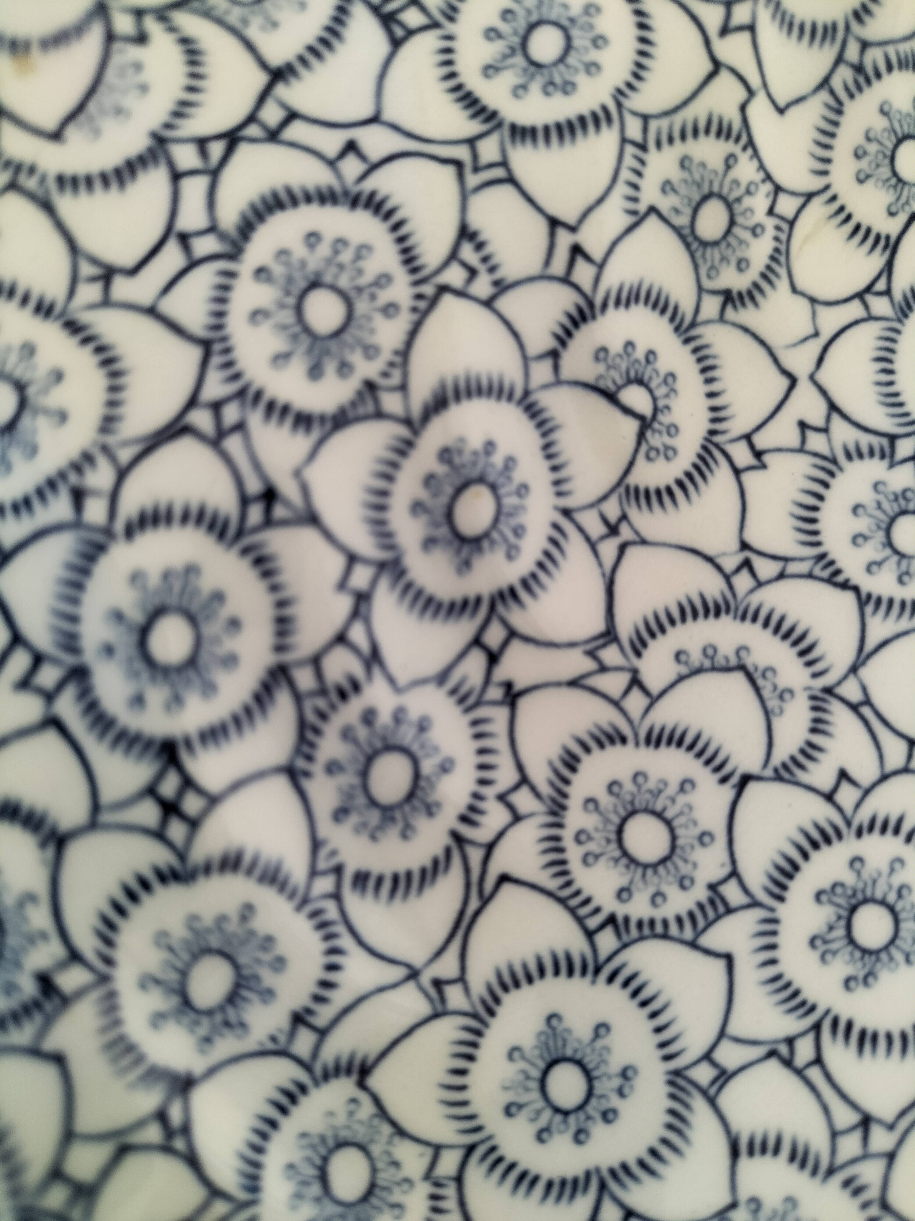 Round antique plate by Johnson Brothers in the Blue Lotus pattern.