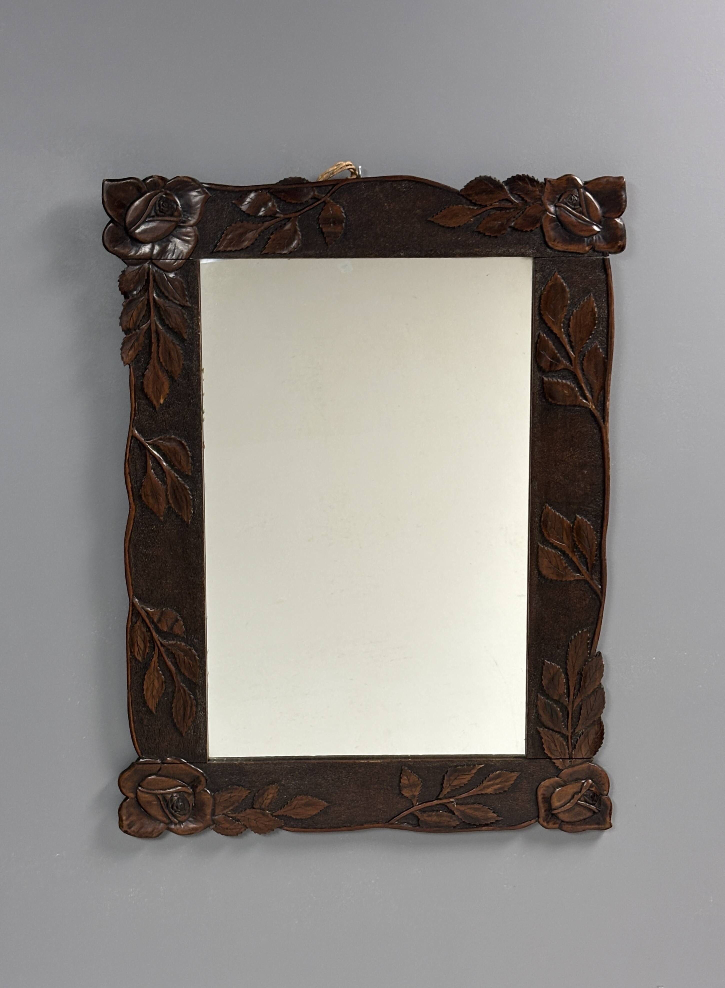 Arts & Crafts hand-carved wall mirror with floral roses, early 20th century