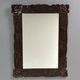 Arts & Crafts hand-carved wall mirror with floral roses, early 20th century