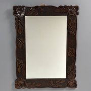 Arts & Crafts hand-carved wall mirror with floral roses, early 20th century