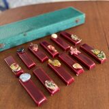 Set of vintage red ceramic knife holders, marine motif, retro style
