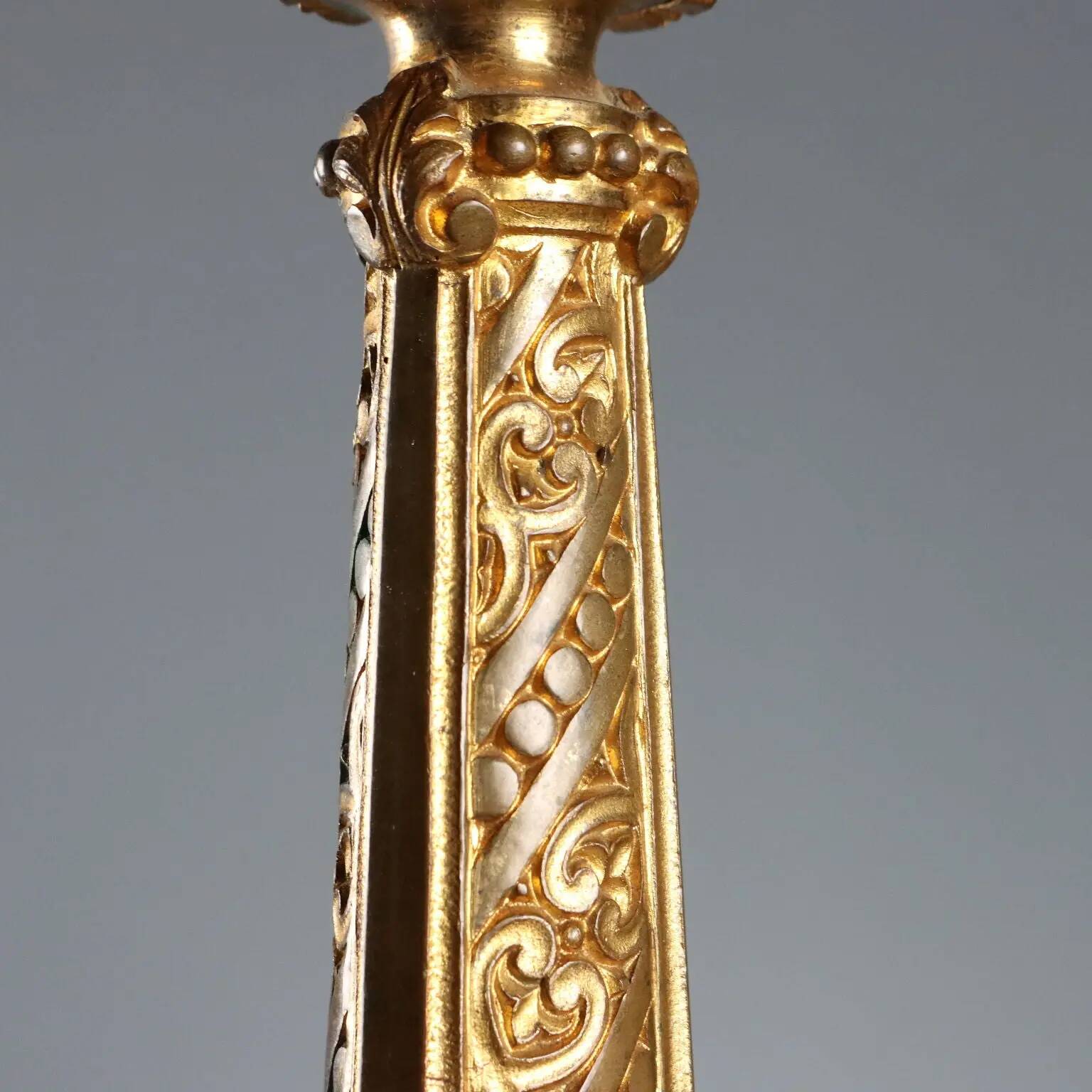 Antique gilded bronze candelabrum, 19th-century decorations.