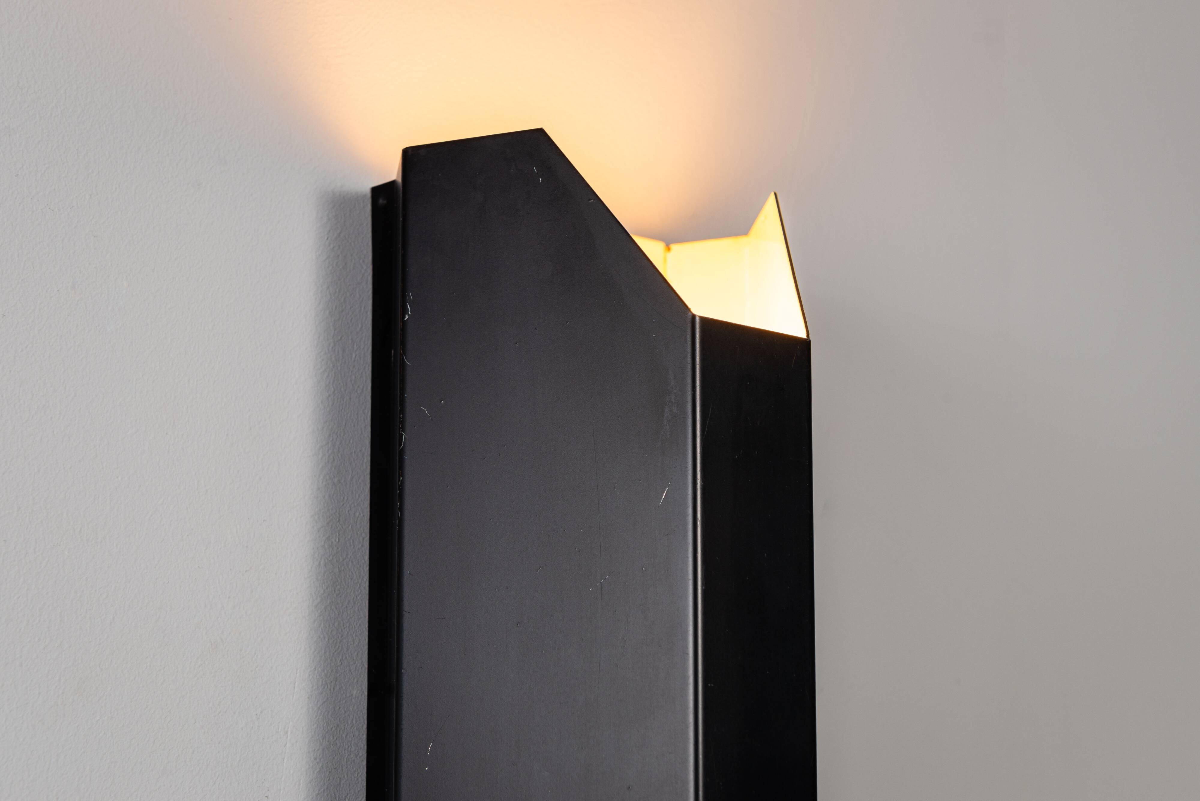Architectural pair of vintage black metal wall lamps with angular geometric