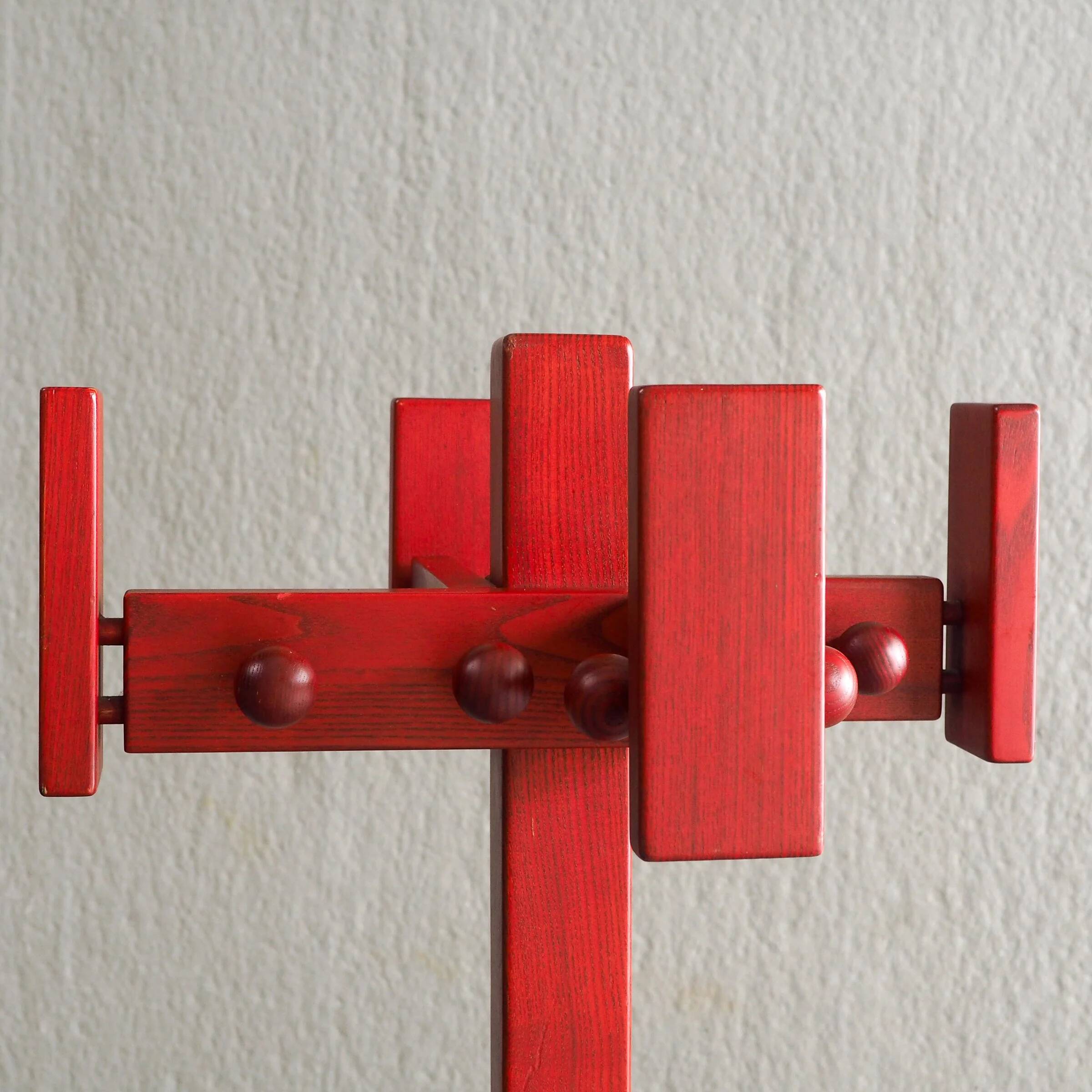 Postmodern red stained pine wood coat hanger
