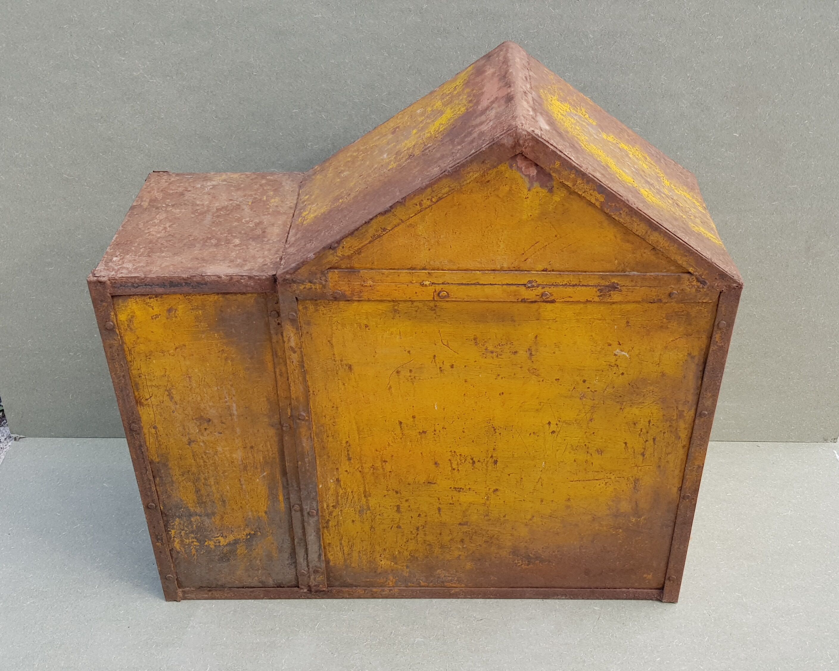 Old atypical metal workshop furniture with its original red patina