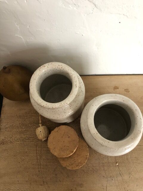 Duo of pots with white sandstone lids