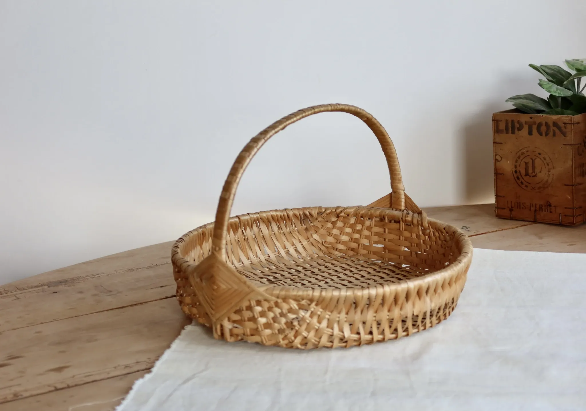Vintage hand-woven wicker harvest basket