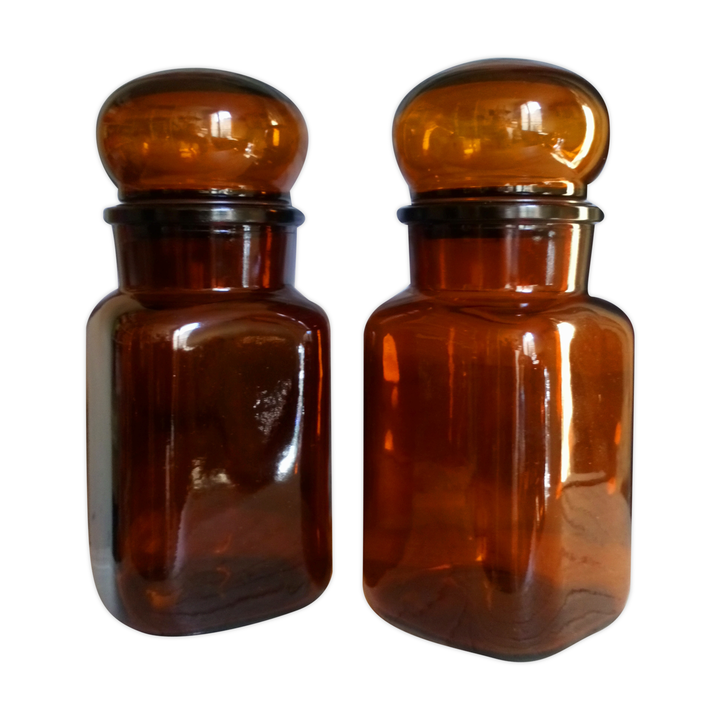 Duo of vintage apothecary bottles in amber glass