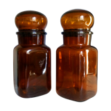 Duo of vintage apothecary bottles in amber glass