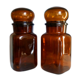 Duo of vintage apothecary bottles in amber glass