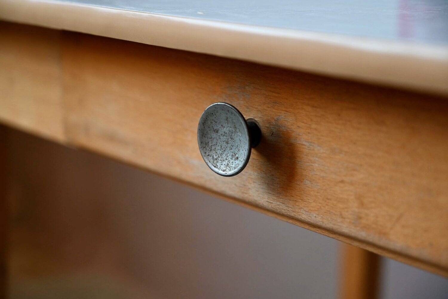 1950s Formica kitchen table with tapered legs and vintage drawer.