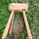 Antique stool in raw wood