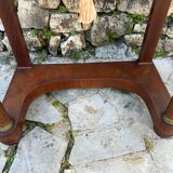 A small piece of Bonheur du jour with detached columns in Empire-era mahogany.