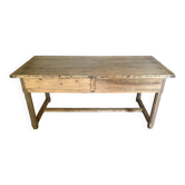 Renovated raw wood farmhouse table