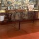 Directoire period extendable dining table in mahogany with a band.