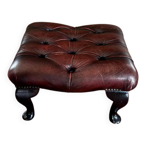 repose pied en cuir rouge