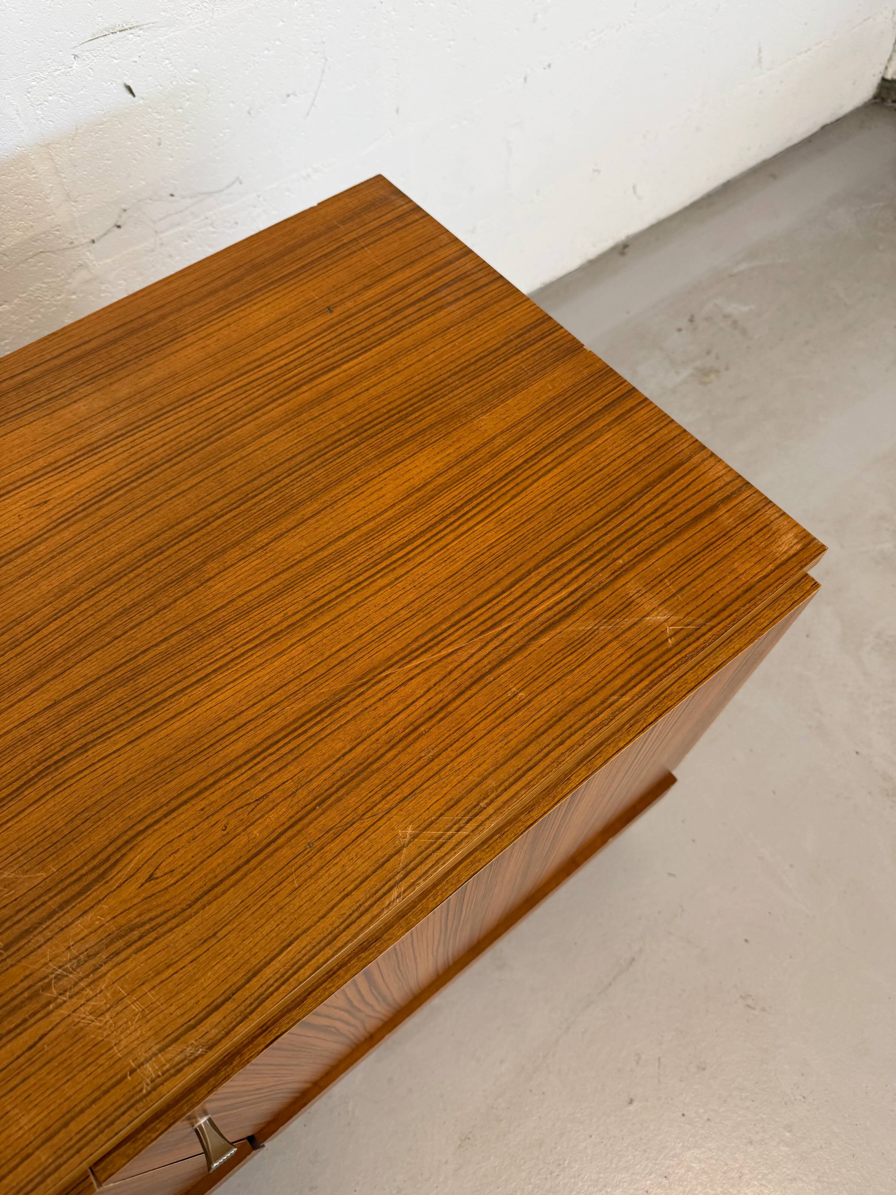 Vintage teak sideboard, mid-century style, with doors and drawers.