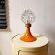 Space age lamp in orange glass and metal, around 1960.
