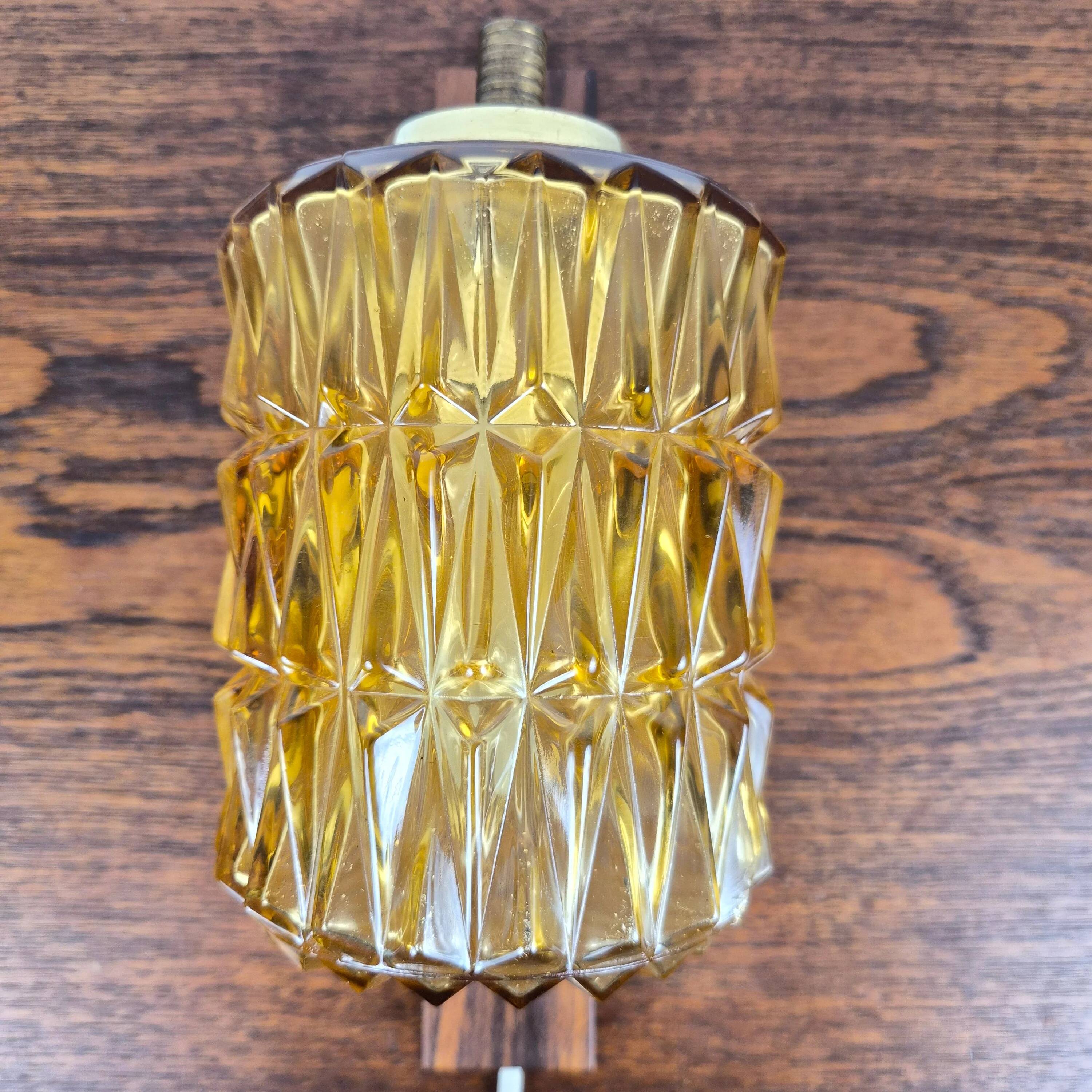 Wall lamp in rosewood, brass and glass, Denmark, 1960.