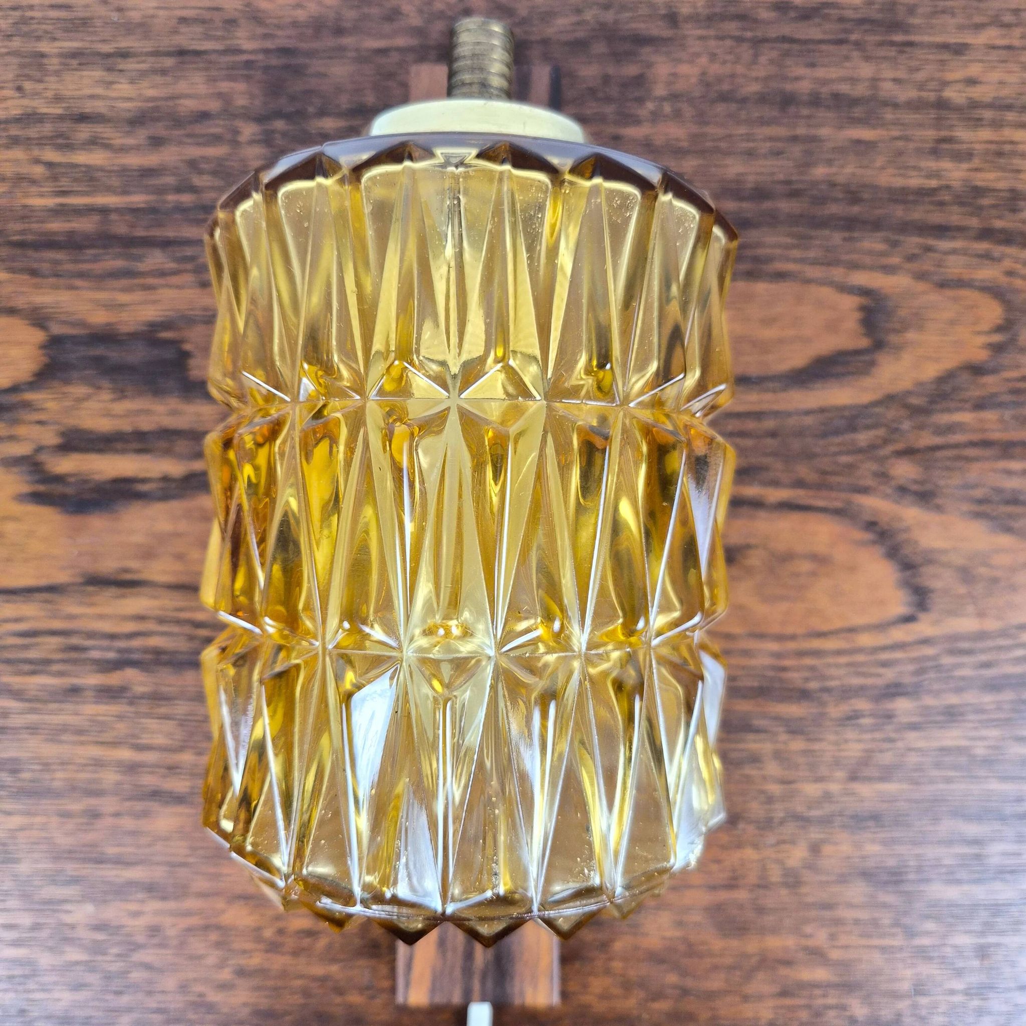 Wall lamp in rosewood, brass and glass, Denmark, 1960.