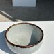 Small white glazed ceramic bowl black edges
