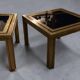 Pair of Romeo Rega side tables in brass and smoked glass, Italy 1970.