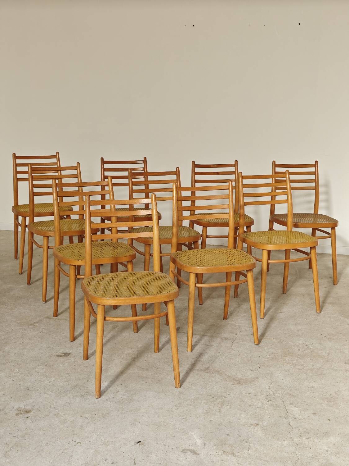 Set of 10 Bystrice tone wooden and caned chairs from the 1960s.