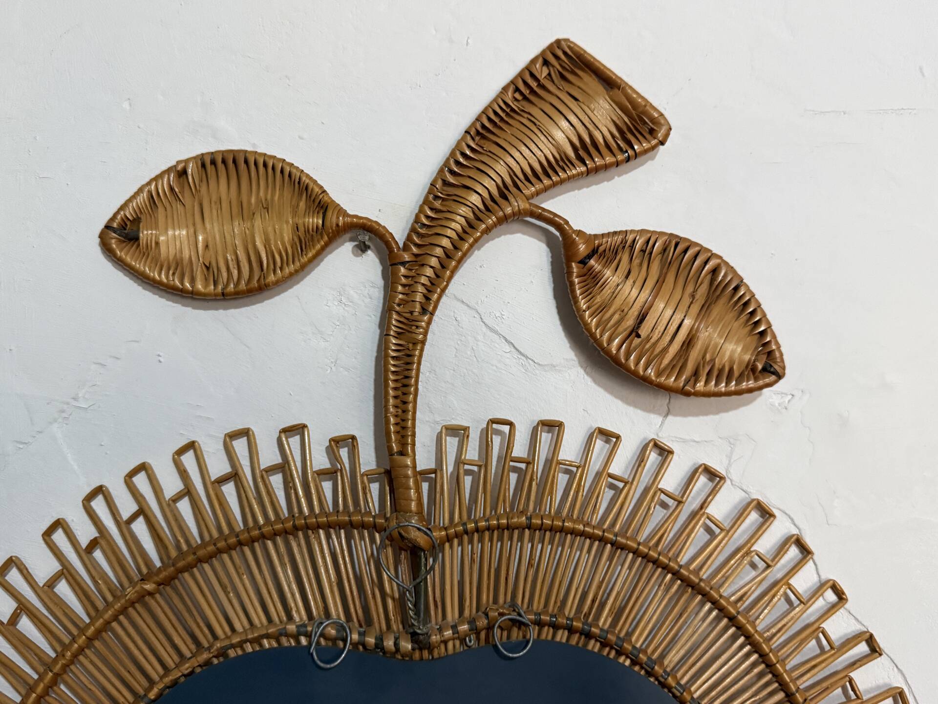 Rattan mirror in the shape of an apple from the 1960s Italy.