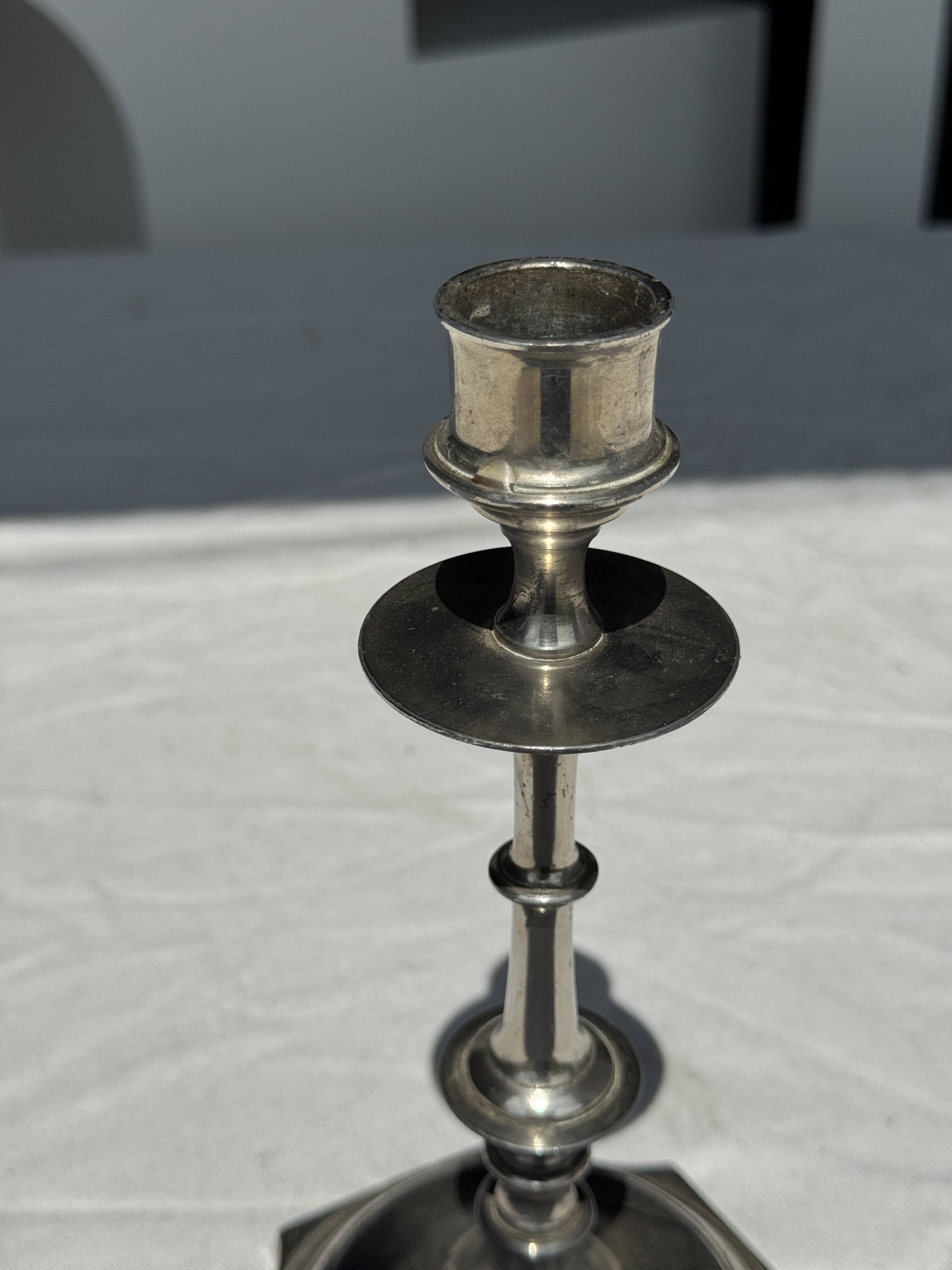 A large silver candlestick holder H23