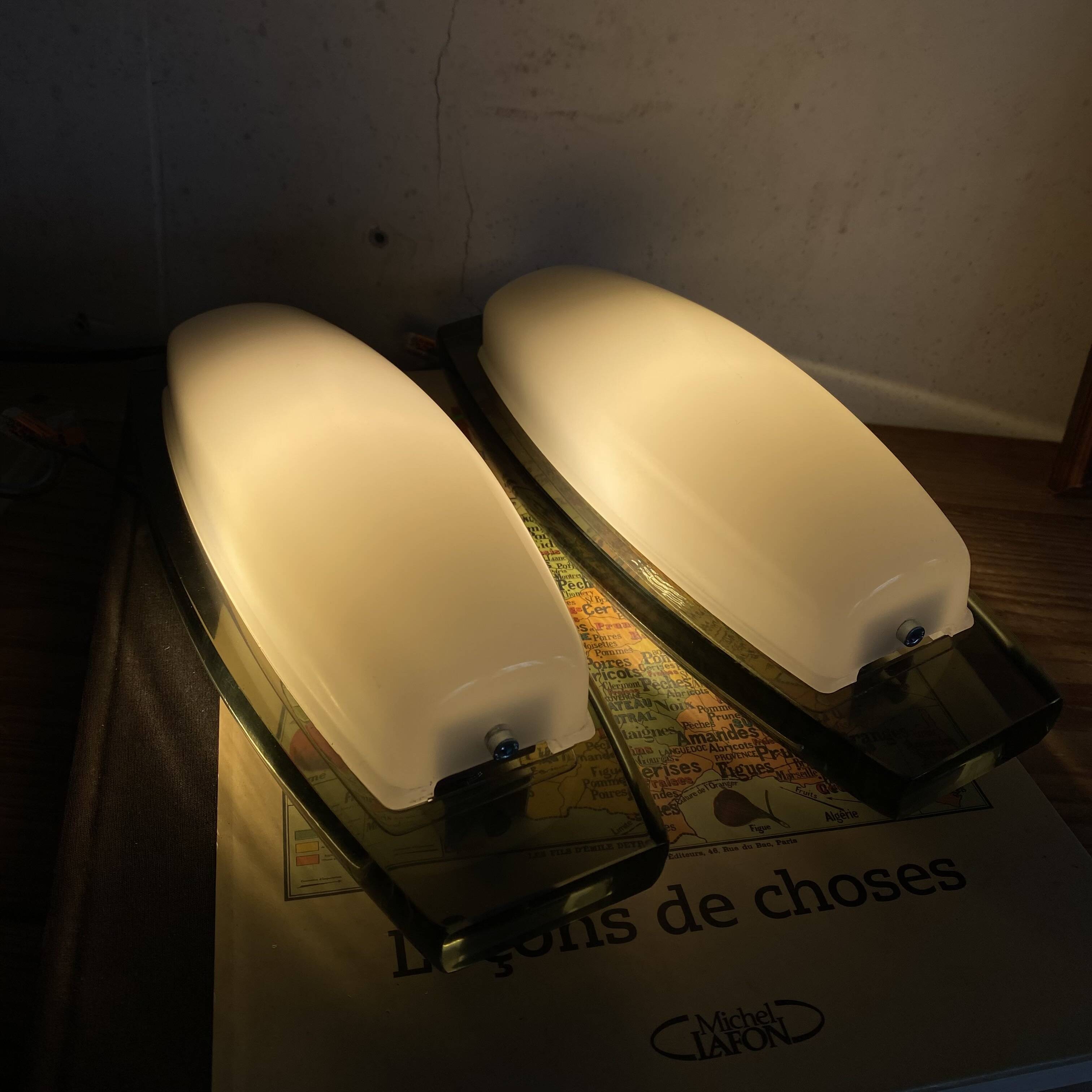 Pair of Veca Fontana wall sconces in smoked and white glass.