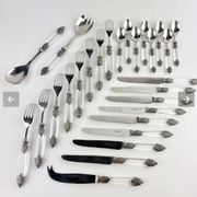 Silver-plated metal cutlery set, plexiglass and stainless steel.