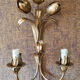 Gold sconces with floral decoration