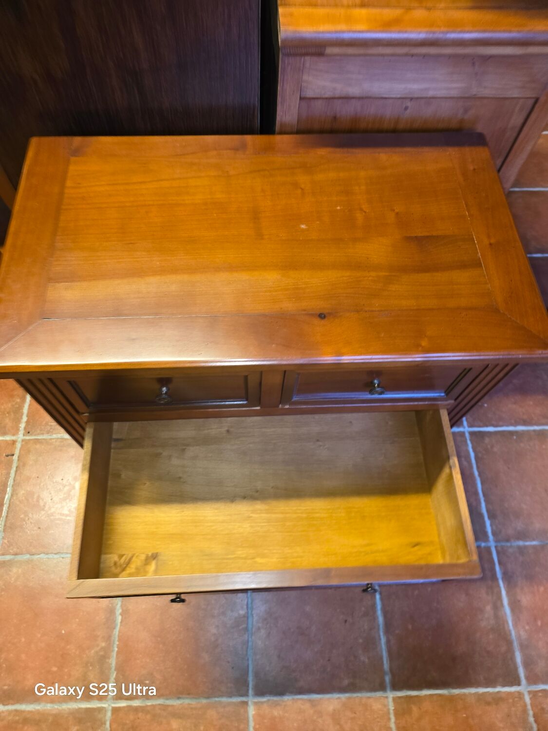Louis XVI style commode in solid cherry wood.