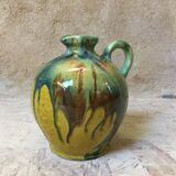 Yellow pitcher with green drips