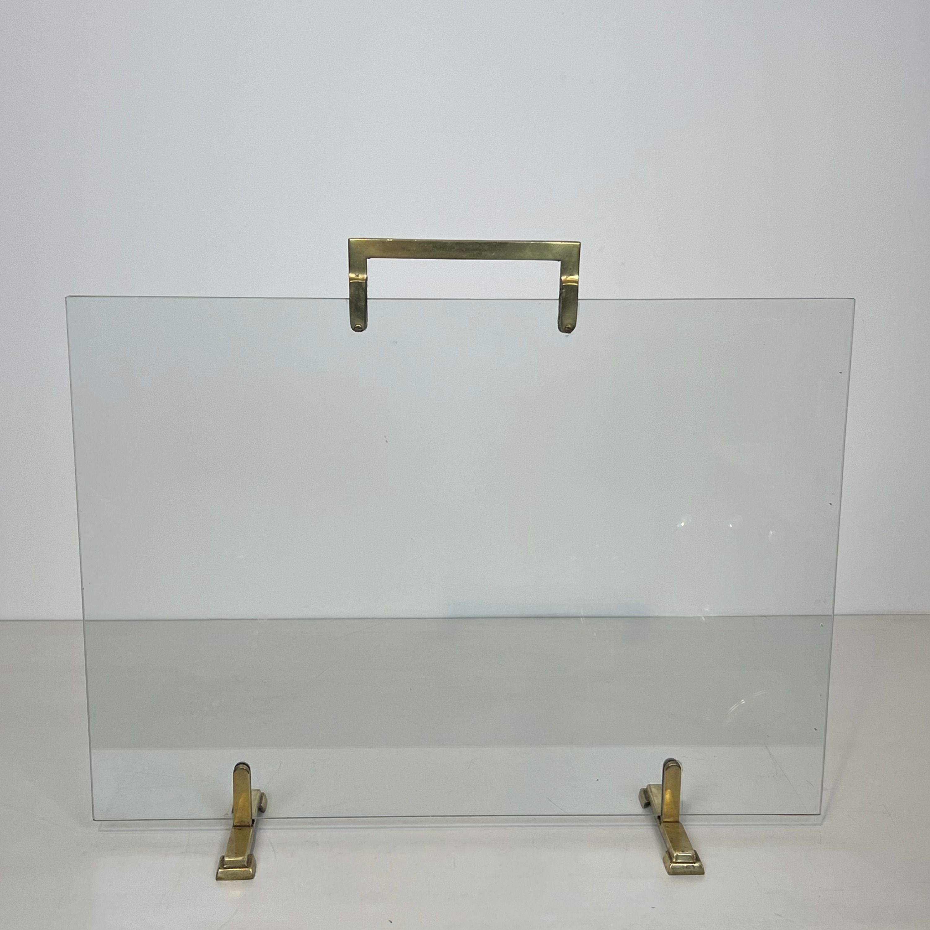 Glass and brass fire screen