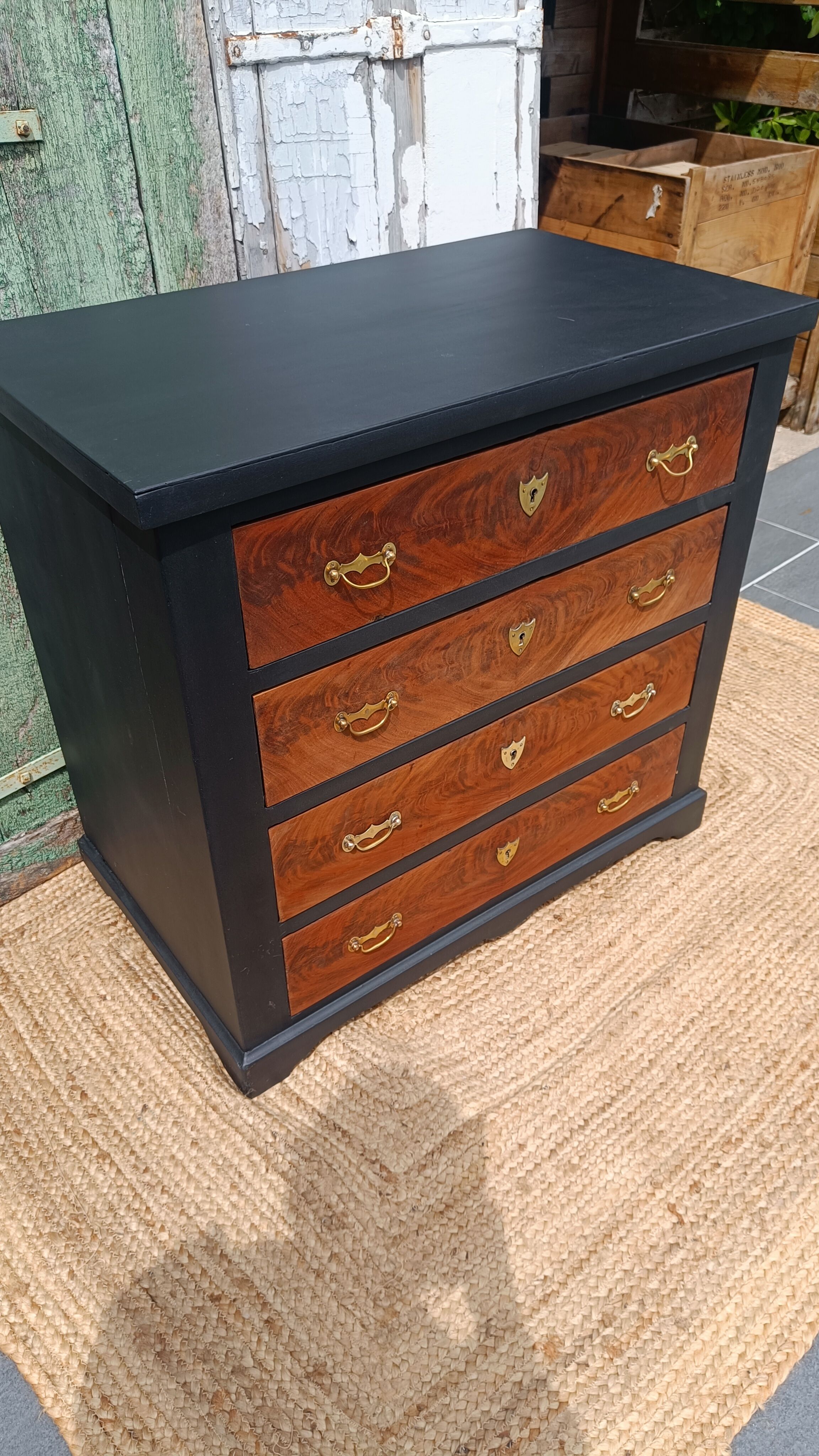 Vintage commode revamped in matte black & wood with warm tones.