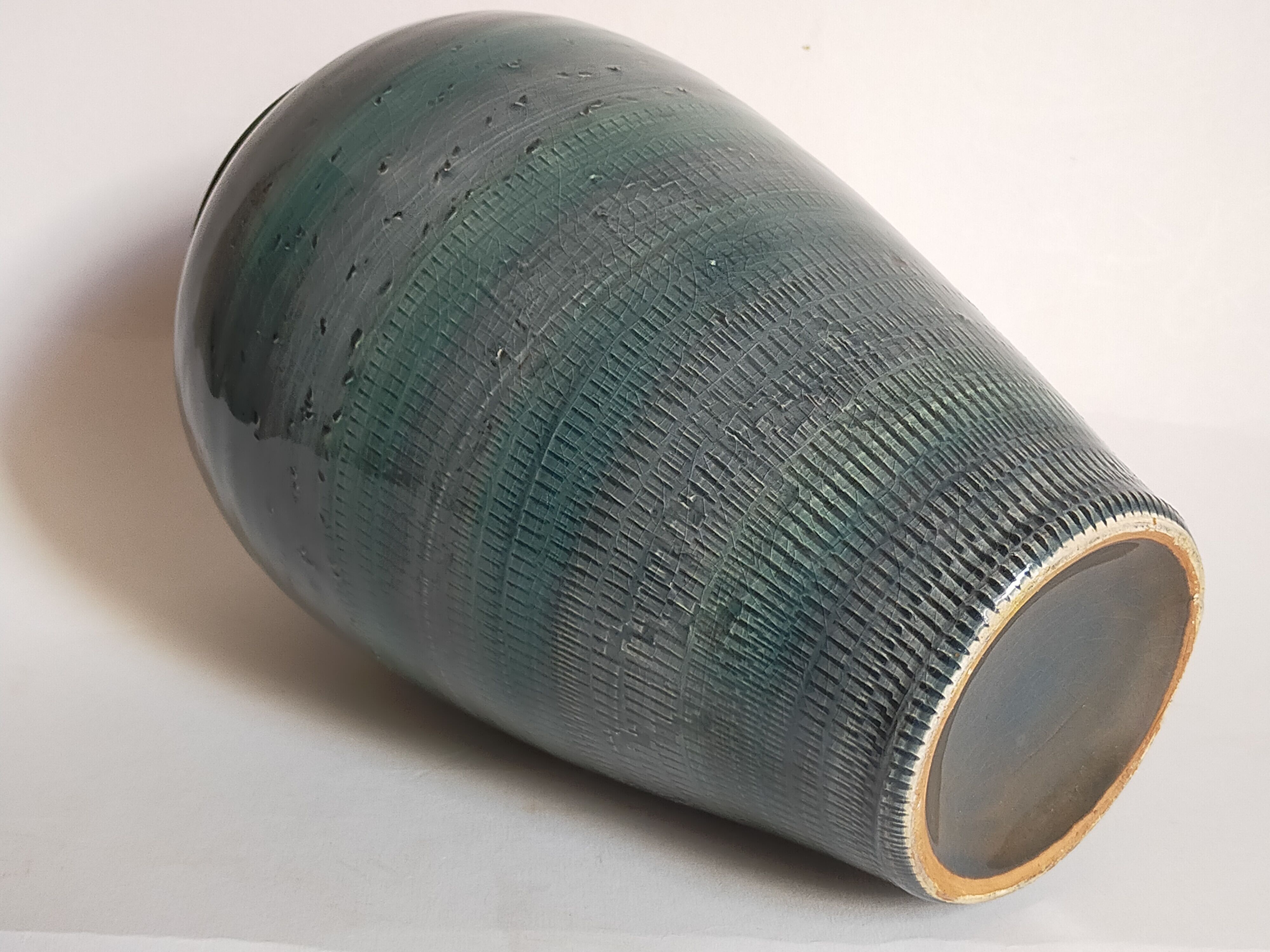 Oblong ceramic vase sacrificed with blue enamel