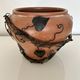 Decorative pot holder in wrought iron and wood