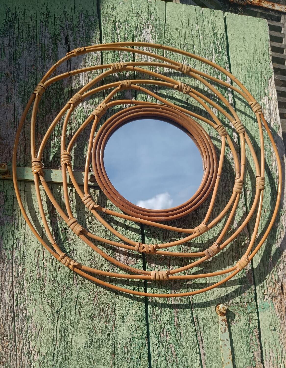 Round rattan mirror