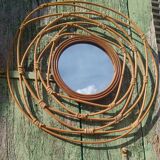 Round rattan mirror
