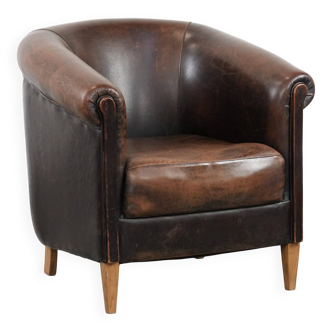 Characterful club armchair made of sheepskin with a beautiful patina