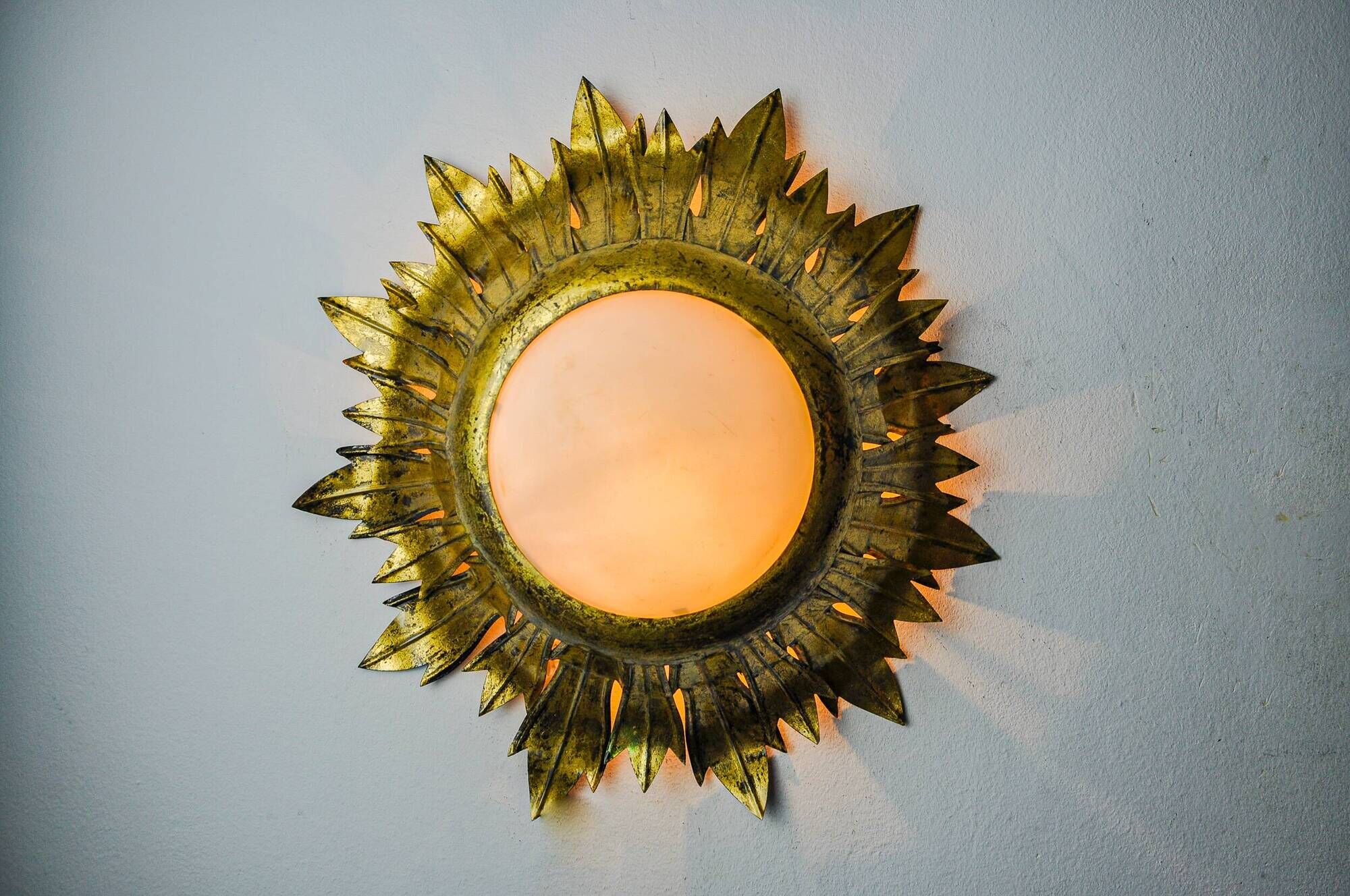 Sun wall lamp by ferro arte, metal and gold leaf, Spain, 1960